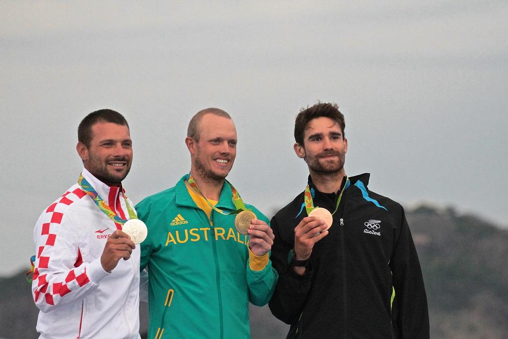 Tonci Stipanovic (CRO), Tom Burton (AUS) and Sam Meech (NZL) with their Silver, Gold and Bronze medals - Mens Laser - 2016 Sailing Olympics  © Richard Gladwell www.photosport.co.nz